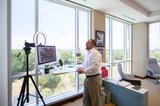 Grow's CEO Thomas Feindt smiles while leading a virtual Town Hall meeting