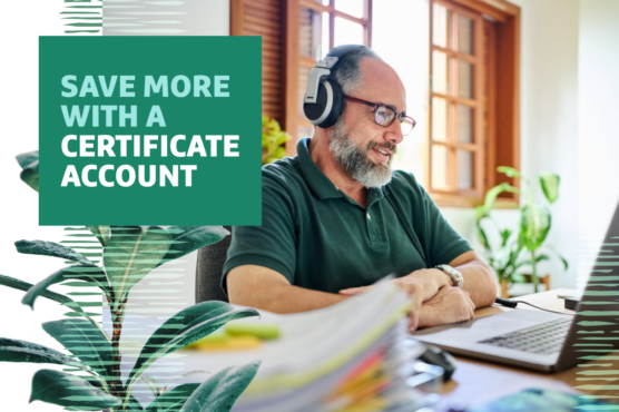 Person with headphones smiling and working on a laptop at a desk with headline overlaid that says 'Save More with a Certificate Account' appearing on the left.