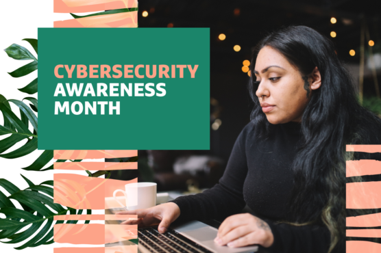 Person using a laptop with a "Cybersecurity Awareness Month" banner displayed prominently in the image.