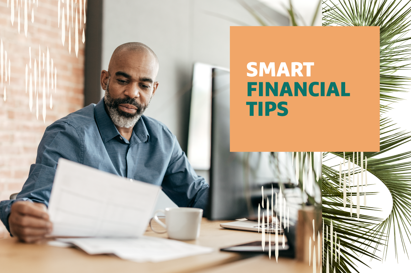 Person reading documents at a desk with a coffee cup, beside a 'Smart Financial Tips' sign.